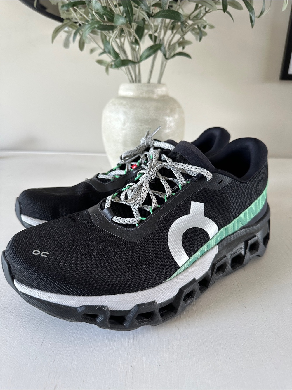 On Running Cloudmonster Shoes - Black with Mint and White Accents